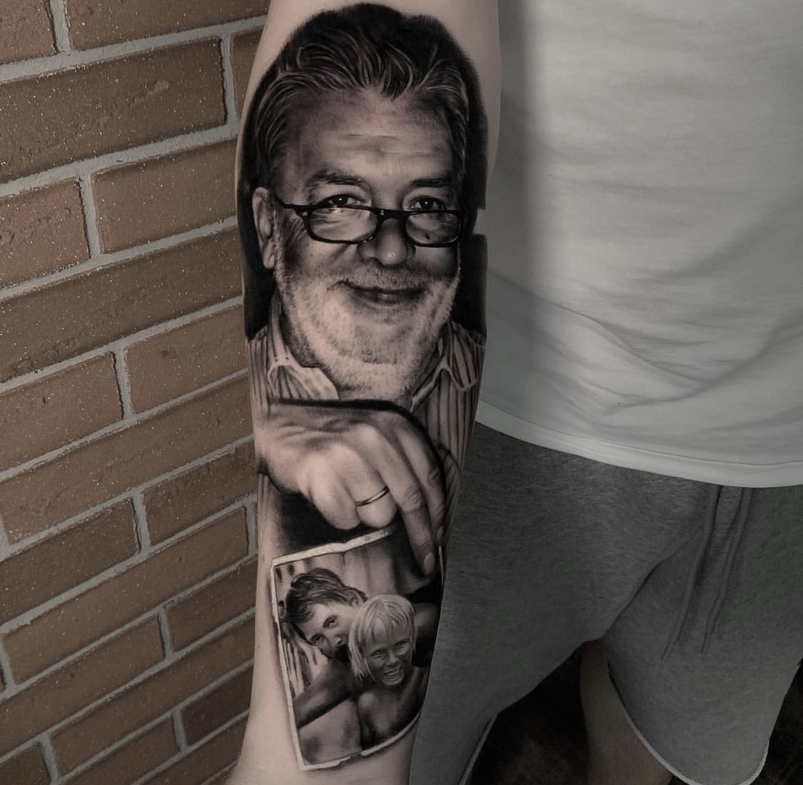 Realistic portrait tattoo on the forearm  